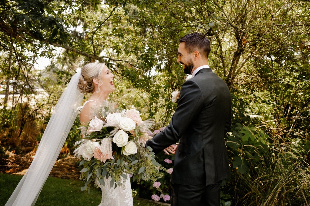 Bride and Groom see each other for the first time with joy on their faces