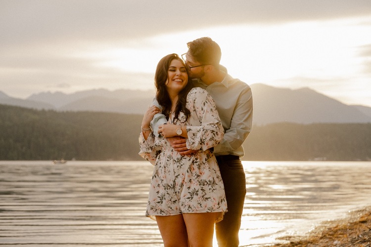 Couple embraced at sunset in the pacific northwest